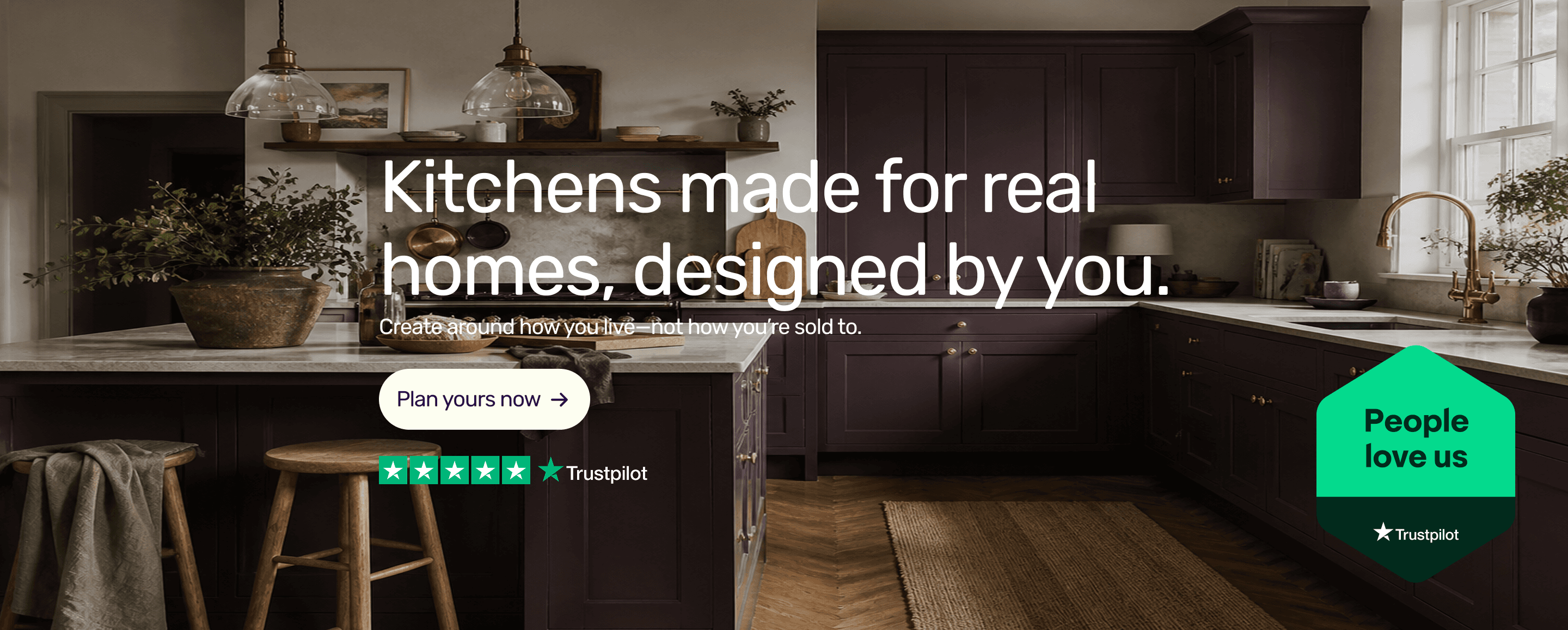 A dark plum kitchen with a marble island
